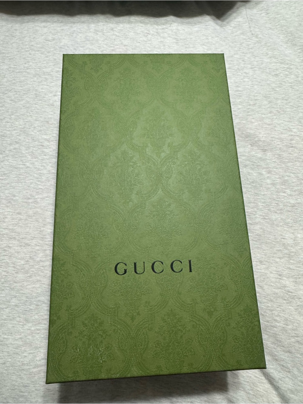 Gucci box - likely shoes or accessory packaging